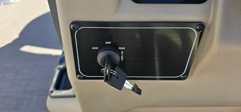 Slide: The Image of 2025 Sun Tracker Bass Buggy 16 XL Select ignition switch with key inserted. - 9