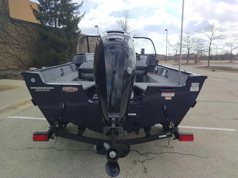 Slide: The Image of 2025 Tracker Pro Guide V-16 WT boat, rear view in parking lot. - 4
