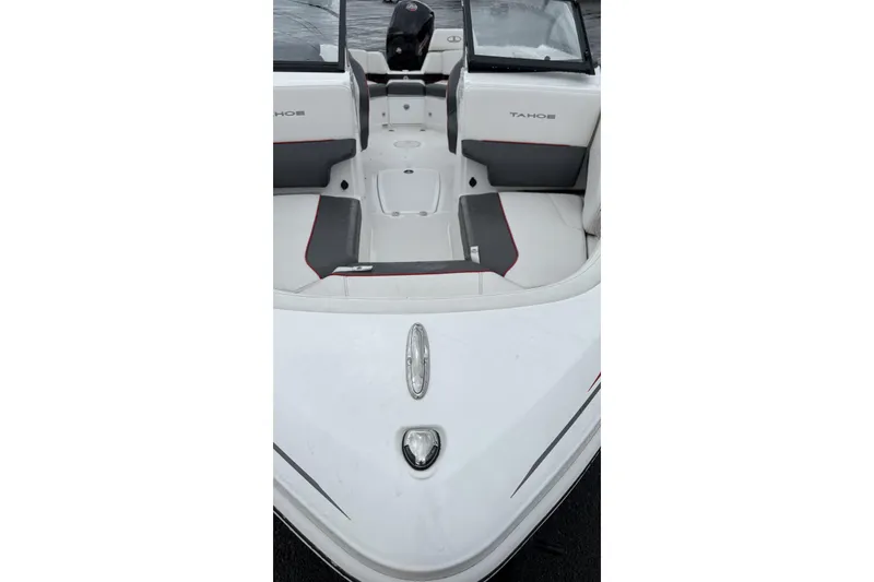 Slide: The Image of 2025 Tahoe 210 S boat interior with gray and white seating, open deck layout. - 4