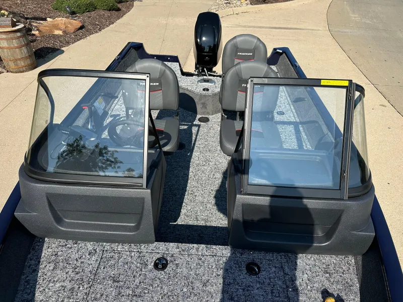 Slide: The Image of 2025 Tracker Pro Guide V-16 WT boat interior with dual windshields and seating. - 4
