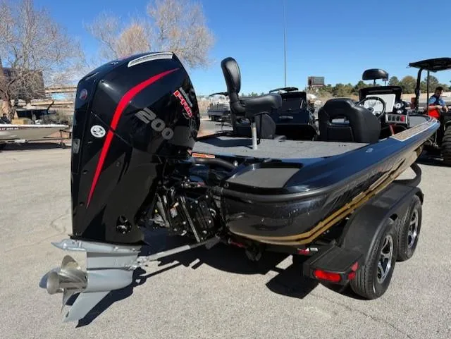 Slide: The Image of 2025 Nitro Z19 Pro boat with powerful 200 horsepower engine, parked outdoors. - 6