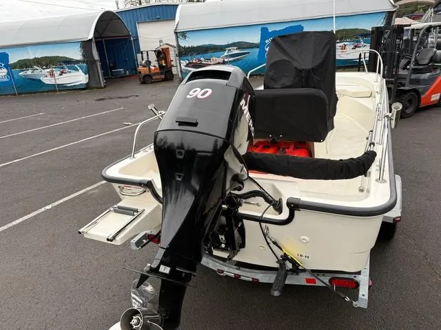 Slide: The Image of 2010 Boston Whaler 170 Montauk boat with 90 HP engine on trailer. - 7