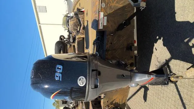 Slide: The Image of 2025 G3 Sportsman 1710 boat with a 90 HP outboard motor, parked outdoors. - 8