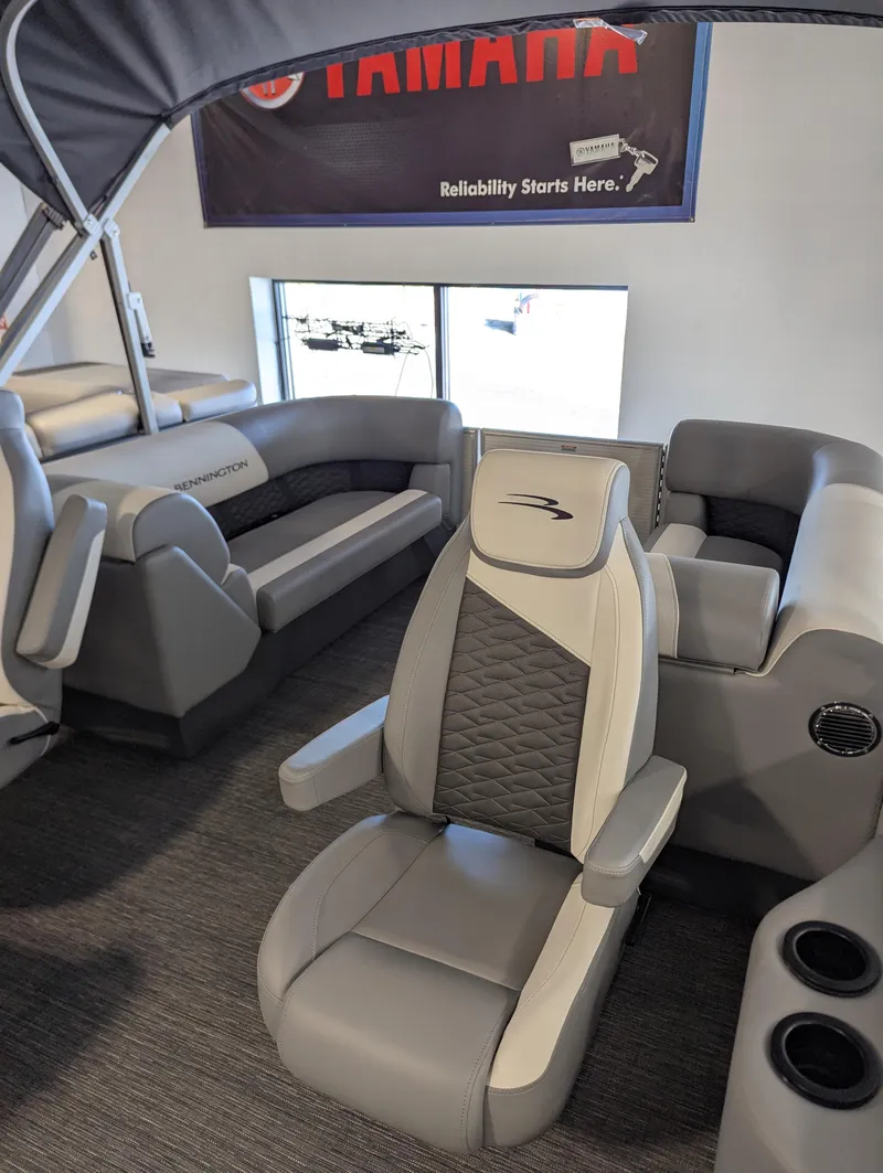Slide: The Image of 2024 Bennington 22SSR boat interior with gray seating and modern design. - 4