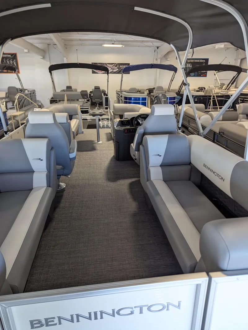 Slide: The Image of 2024 Bennington 22SSR pontoon boat interior with gray seating and canopy. - 9