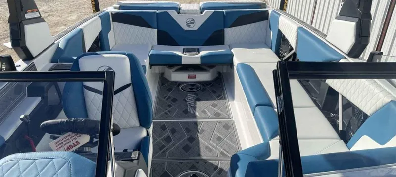 Slide: The Image of 2024 Tigé Z5 boat interior with blue and white seating, modern design. - 3