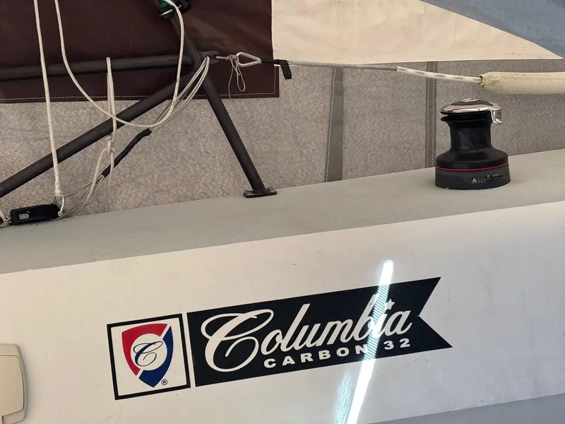 Slide: The Image of Columbia Yacht Carbon 32, 2012 model, featuring deck rigging and winch. - 11