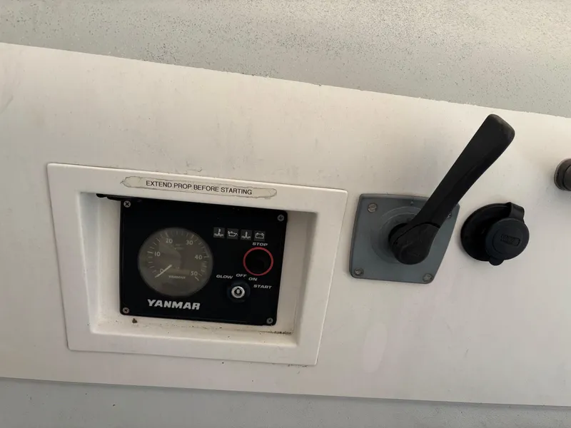 Slide: The Image of Control panel of a 2012 Columbia Yacht 32 with Yanmar engine display. - 12