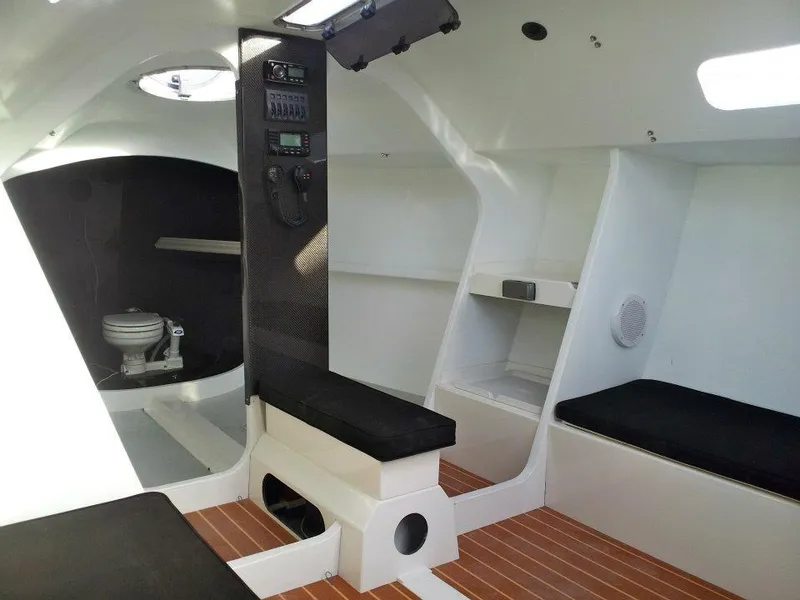 Slide: The Image of Interior of 2012 Columbia Yacht 32, featuring modern design and wooden flooring. - 13