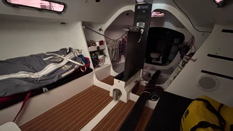 Slide: The Image of Interior of 2012 Columbia Yacht 32, featuring cozy cabin space and nautical equipment. - 14