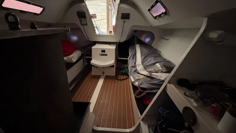 Slide: The Image of Interior of 2012 Columbia Yacht 32, featuring cozy sleeping quarters and wooden flooring. - 16