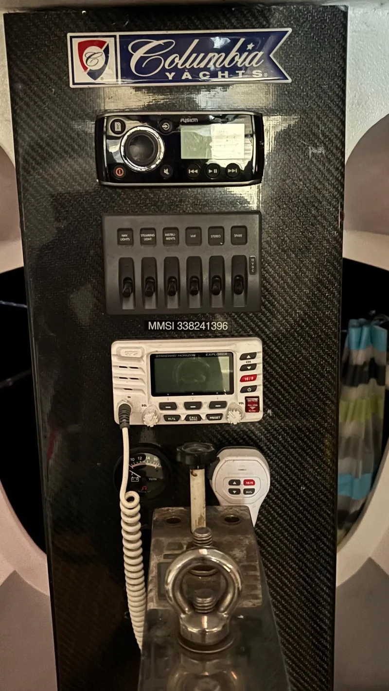 Slide: The Image of Control panel of a 2012 Columbia Yacht 32 with radio and navigation equipment. - 19