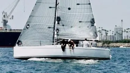 Slide: The Image of Sailing Columbia Yacht 32, 2012 model, on open water with crew onboard. - 3