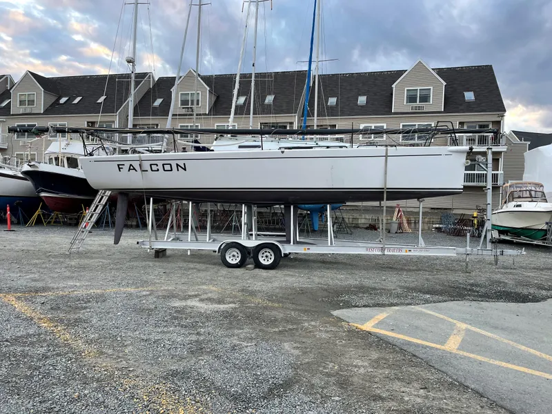 Slide: The Image of Columbia Yacht 32, 2012 model, on trailer in marina with buildings in background. - 5