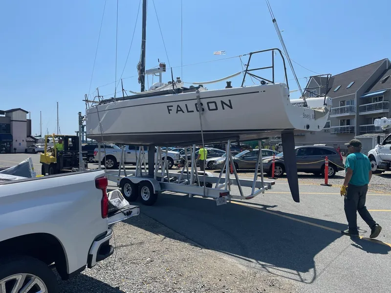 Slide: The Image of Columbia Yacht 32, 2012 model, named "Falcon" on trailer at marina. - 6