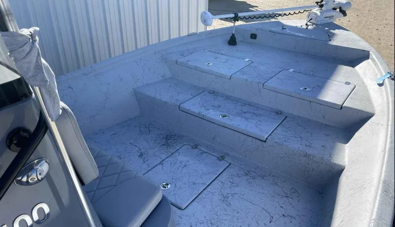 Slide: The Image of 2024 Blazer Bay 2400 boat interior with storage compartments and seating. - 20