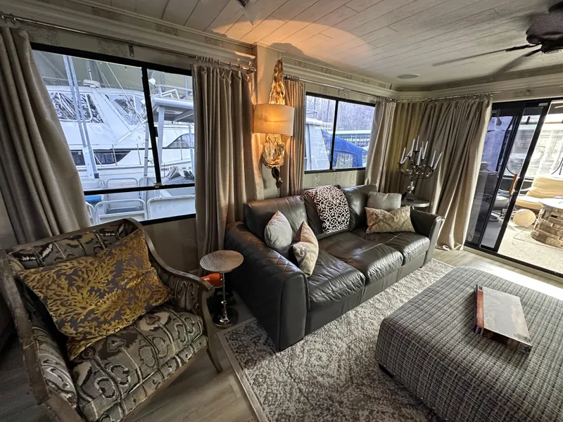 Slide: The Image of Luxurious interior of a 1991 Sumerset 14x60 houseboat with elegant furnishings and large windows. - 2