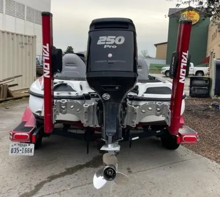 Slide: The Image of 2016 Nitro Z21 boat with 250 Pro engine and Talon anchors, parked on trailer. - 2