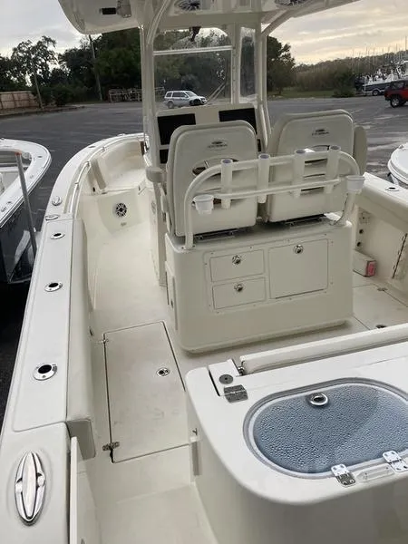 Slide: The Image of 2024 Cobia 262 CC boat interior with seating and storage compartments. - 14