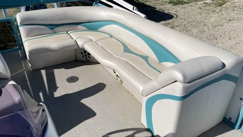 Slide: The Image of 2022 Aloha Pontoon Mahalo 250 boat seating with beige and teal upholstery. - 7