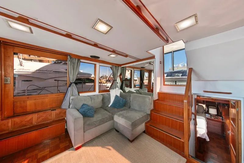 Slide: The Image of Luxurious interior of 1989 Lien Hwa Vitesse Yachtfisher with plush seating and wooden accents. - 10