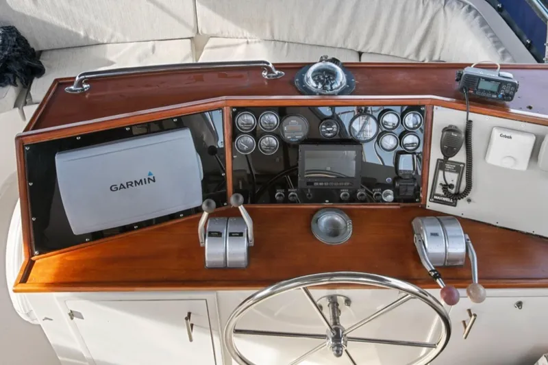Slide: The Image of 1989 Lien Hwa Vitesse Yachtfisher helm with Garmin navigation and control instruments. - 12