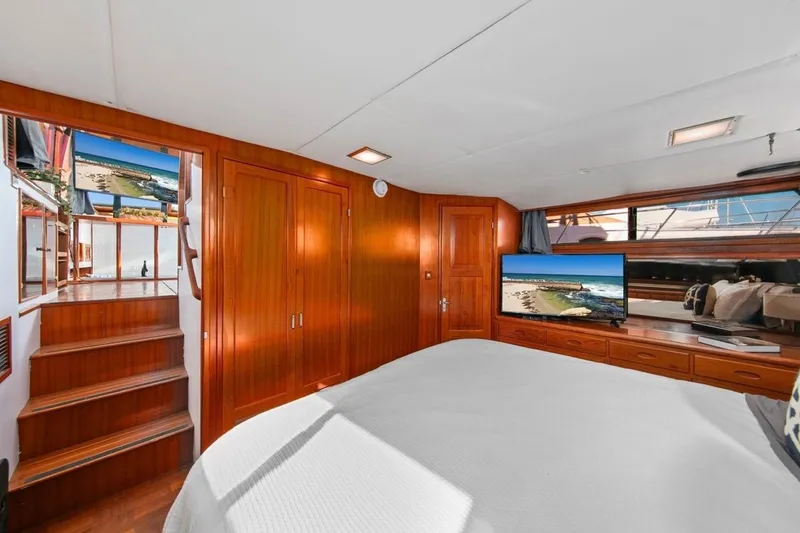 Slide: The Image of Luxurious 1989 Lien Hwa Vitesse Yachtfisher interior with wood paneling and modern amenities. - 21