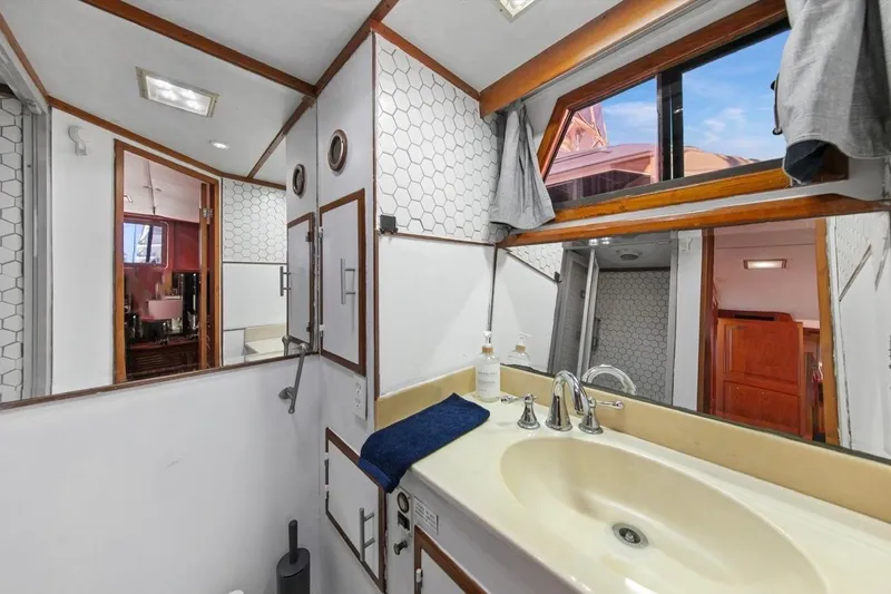 Slide: The Image of Bathroom interior of 1989 Lien Hwa Vitesse Yachtfisher with hexagonal tiles and skylight. - 22