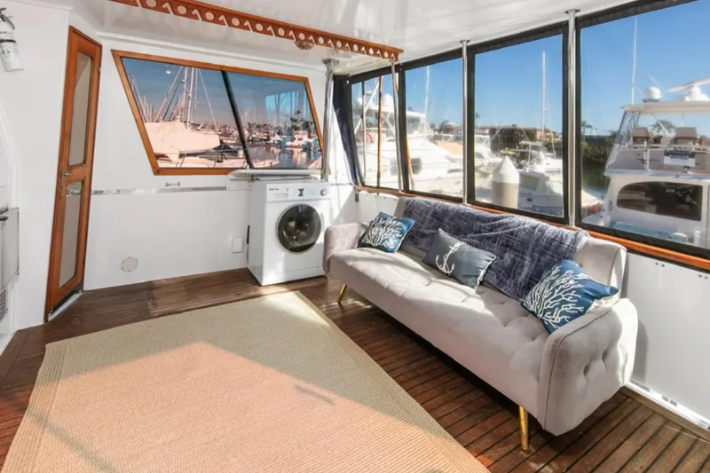 Slide: The Image of Luxurious 1989 Lien Hwa Vitesse Yachtfisher interior with sofa, washing machine, and marina view. - 30