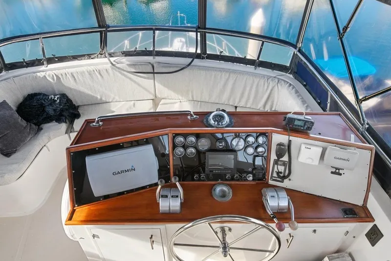 Slide: The Image of 1989 Lien Hwa Vitesse Yachtfisher helm with Garmin navigation and classic controls. - 39