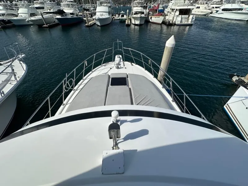 Slide: The Image of 1989 Lien Hwa Vitesse yacht docked in a marina, surrounded by other boats. - 42