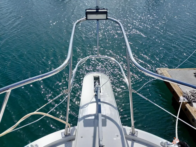 Slide: The Image of Bow view of 1989 Lien Hwa Vitesse yacht on sparkling water. - 44