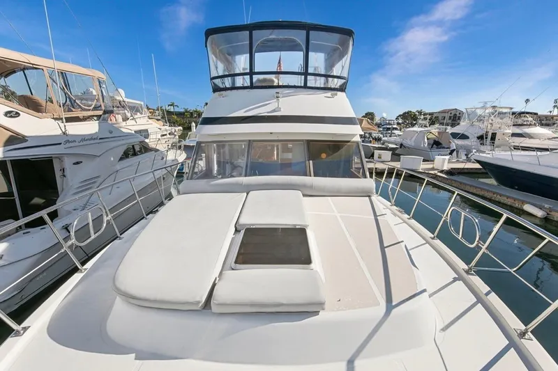 Slide: The Image of 1989 Lien Hwa Vitesse Yachtfisher docked in marina, clear sky, luxury boat. - 45