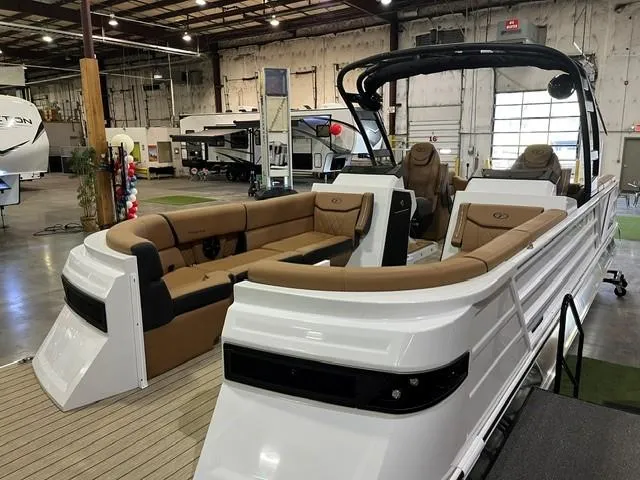 Slide: The Image of 2025 Veranda VX27DCRC pontoon boat with luxurious seating in a showroom. - 3