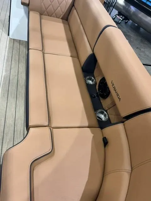 Slide: The Image of 2025 Veranda VX27DCRC boat seating with tan upholstery and cup holders. - 5