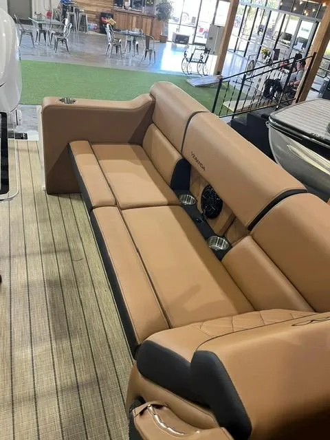 Slide: The Image of 2025 Veranda VX27DCRC boat interior with tan leather seating and modern design. - 7