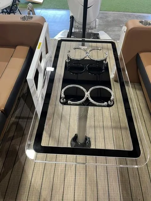 Slide: The Image of 2025 Veranda VX27DCRC boat interior with sleek table and cup holders. - 8