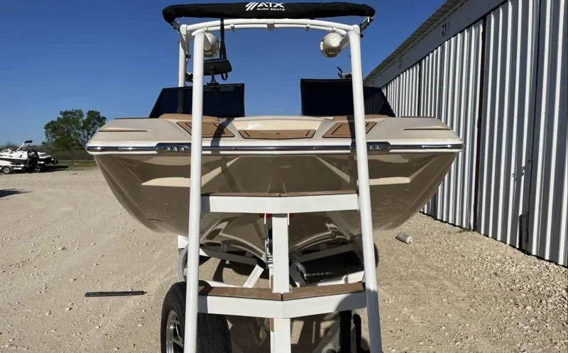 Slide: The Image of 2024 ATX Surf Boats 24 Type-S on trailer, front view, outdoors. - 5