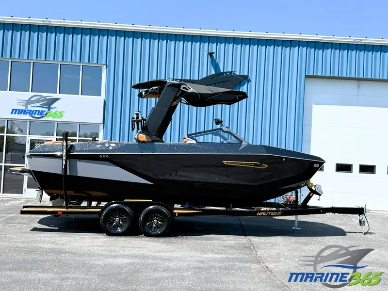 The Image of 2025 Nautique Super Air Nautique G23 boat on trailer outside Marine365 building. - 0
