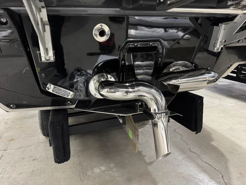 Slide: The Image of 2025 Nautique Super Air Nautique G23 boat exhaust system, showcasing sleek chrome detailing. - 28