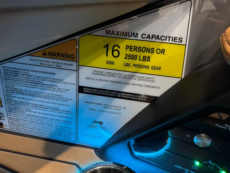 Slide: The Image of 2025 Nautique Super Air Nautique G23 capacity label, 16 persons or 2500 lbs limit. - 30