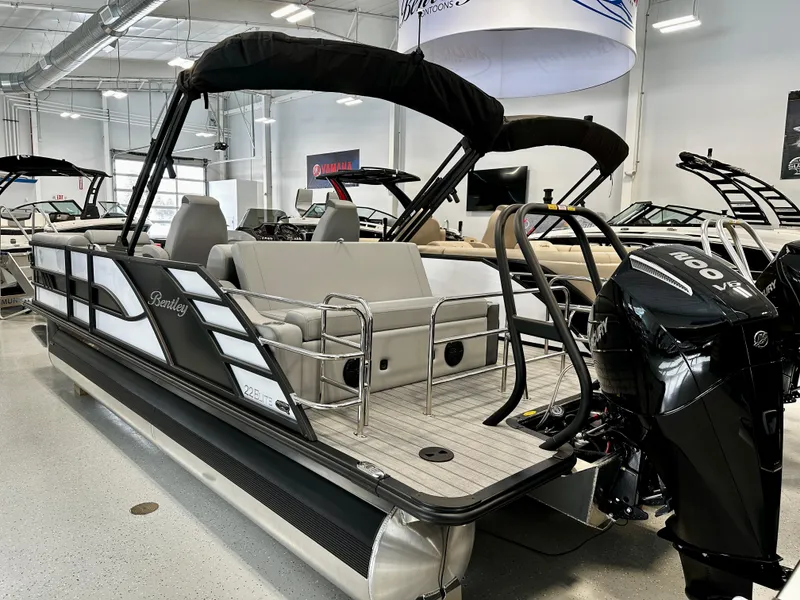 Slide: The Image of 2025 Bentley Pontoons Elite 223 Swingback in showroom, featuring sleek design and modern amenities. - 3