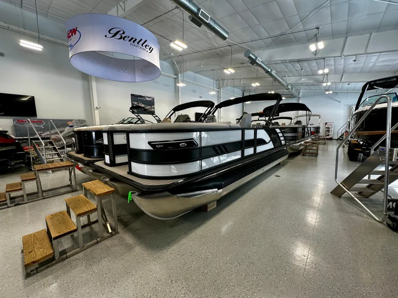 Slide: The Image of 2025 Bentley Pontoons Elite 223 Swingback displayed in a showroom. - 4