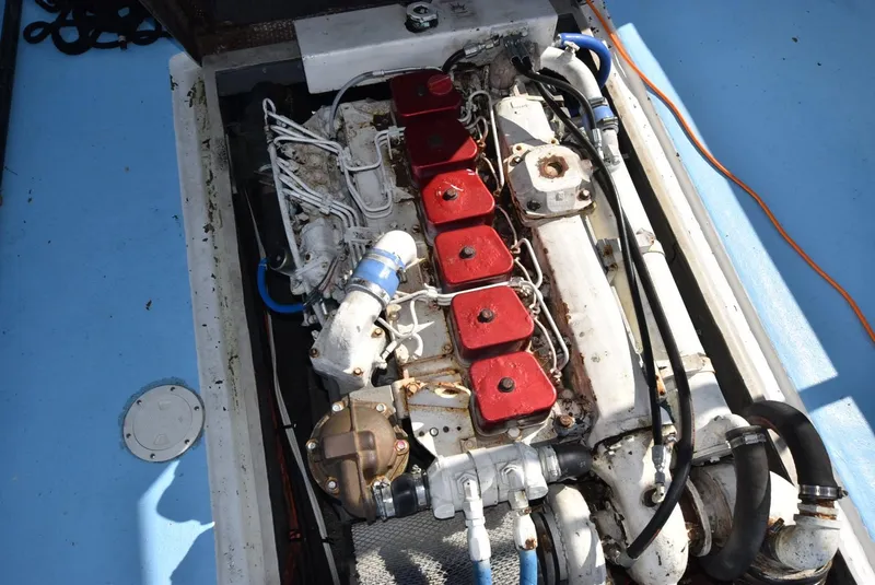 Slide: The Image of Custom Downeast 2011 boat engine with red components and visible wiring. - 13