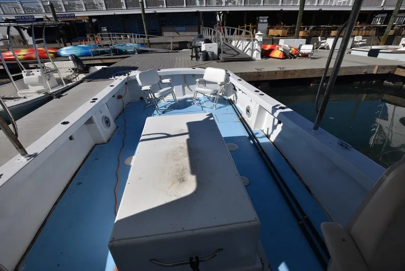 Slide: The Image of Open deck of a 2011 Custom Downeast boat docked at a marina. - 7