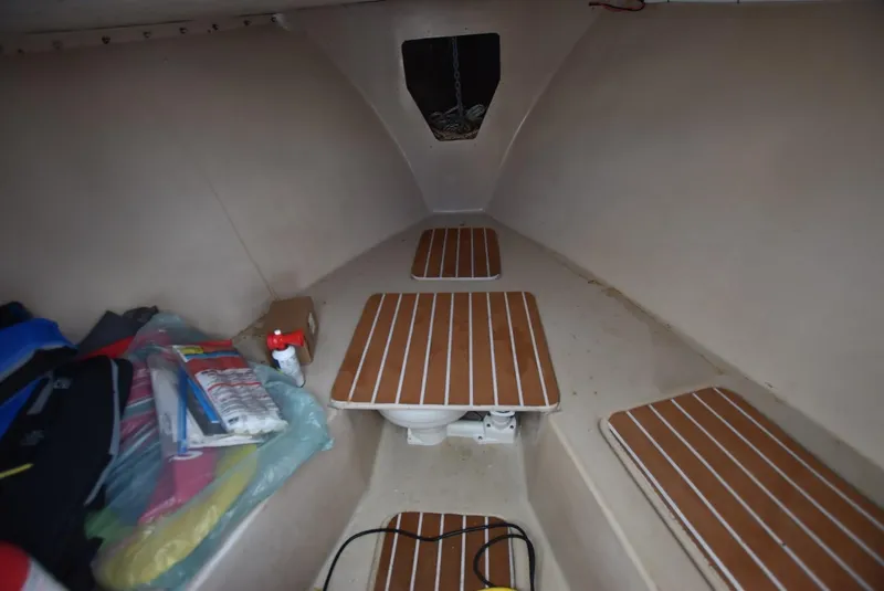 Slide: The Image of Interior of 2011 Custom Downeast boat with wooden flooring and storage items. - 9