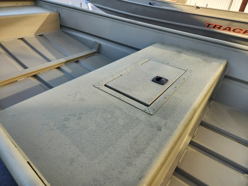 Slide: The Image of 2025 Tracker 1542 LW boat interior with storage compartment and seating. - 4