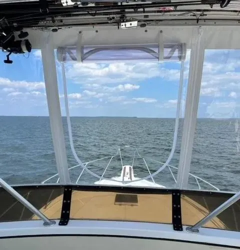 Slide: The Image of Viking 40 boat on open water, clear sky, 1973 model, diesel engines, 950 hours. - 13