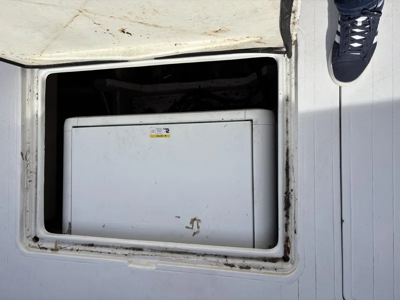 Slide: The Image of Open hatch on Viking 40 boat revealing storage compartment, 1973 model. - 17