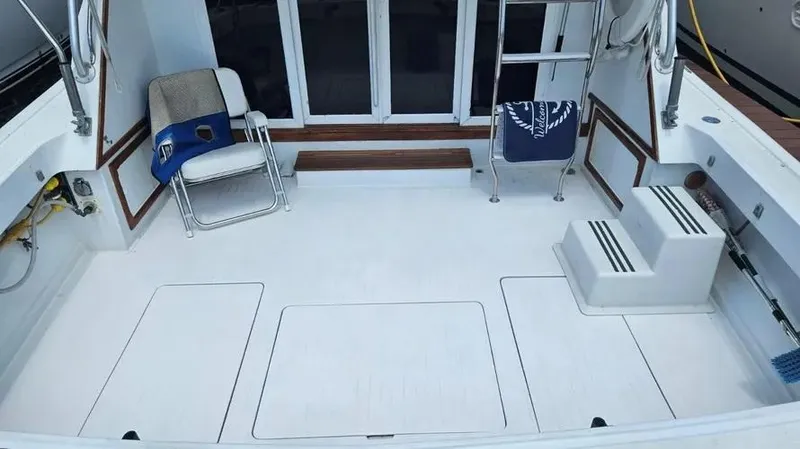 Slide: The Image of Spacious deck of a 1973 Viking boat with seating and steps. - 18
